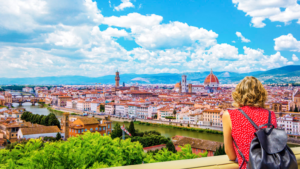 Traveler, overlooking Florence, the Duomo, and Piazza della Signoria, Italy